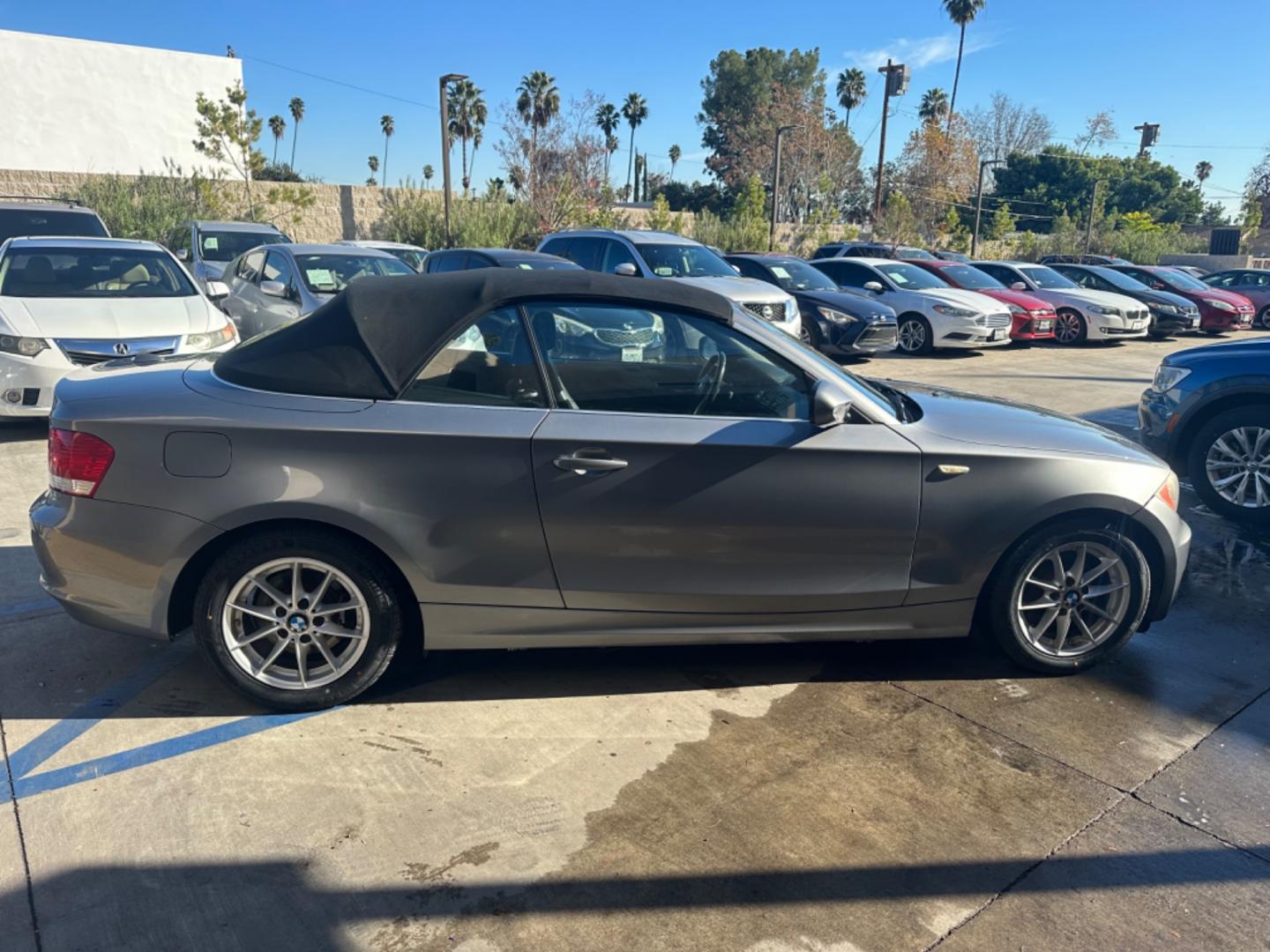 2011 Gray /Black BMW 1-Series 128i Convertible (WBAUN1C52BV) with an 3.0L L6 DOHC 24V engine, Automatic transmission, located at 30 S. Berkeley Avenue, Pasadena, CA, 91107, (626) 248-7567, 34.145447, -118.109398 - Low Miles!!! Elevate your driving experience with our 2011 BMW 1-Series 128i Convertible, now featured at our Buy Here Pay Here (BHPH) dealership in Pasadena, CA. Ideal for enthusiasts in Altadena CA, Glendale CA, Los Angeles CA, and throughout LA County, this stunning pre-owned convertible combine - Photo#5